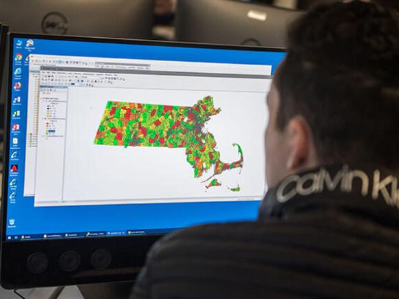 Student learning how to use digital surveyor map.