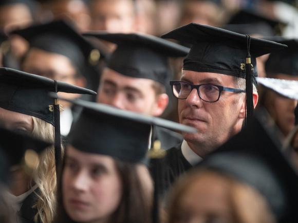 Students at Graduate Commencement wearing caps