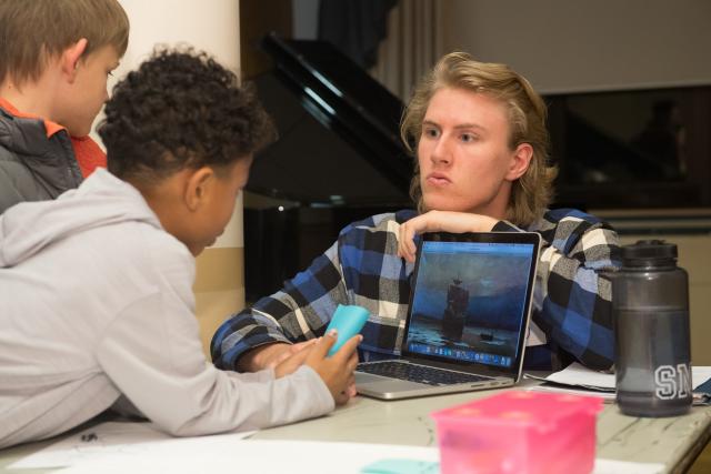 Westfield State student teacher with students