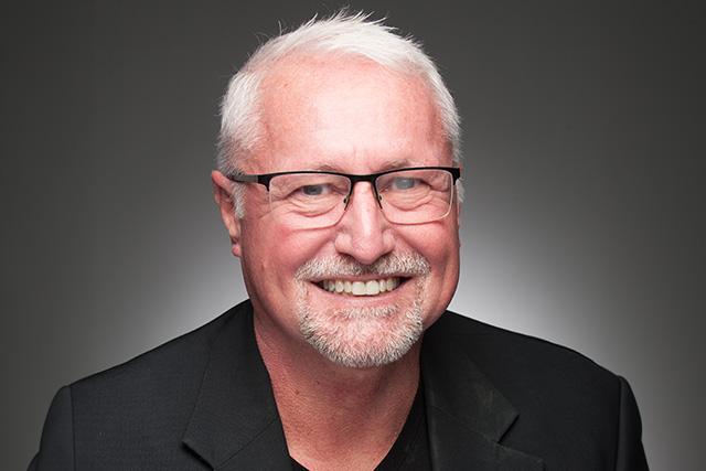 Robert Hayes, Ph.D., Chair of the Psychology Department poses for a professional photo.