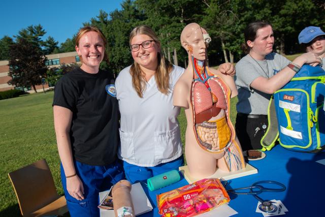 Nursing students smiling at Clubs Fair 