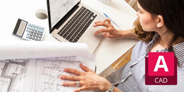 Person reviewing architectural blueprints while working on a laptop with CAD software.