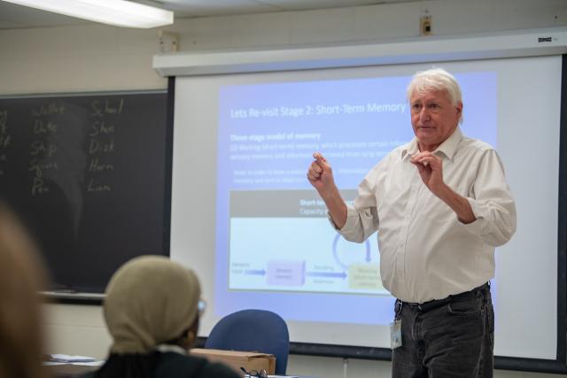 Psychology faculty member in classroom.