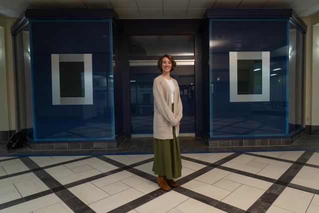 Criminal justice student smiling while working at an internship.