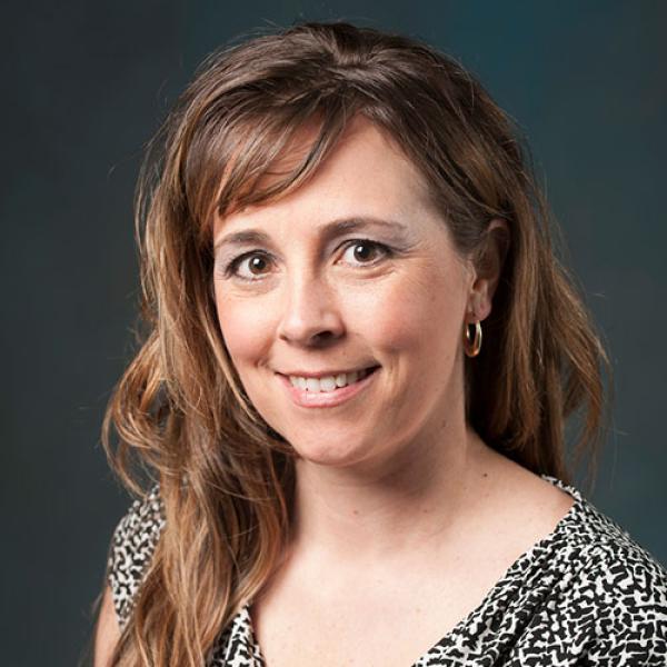 Jamie Rivera, Ph.D., RN, CPN, Chair of the Nursing Department at Westfield State University, smiles while posing for a professional photo.