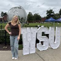 student leader on green